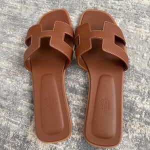 Almost new Hermes Oran Sandals. Worn ONCE. Dust bags, box and receipt included.